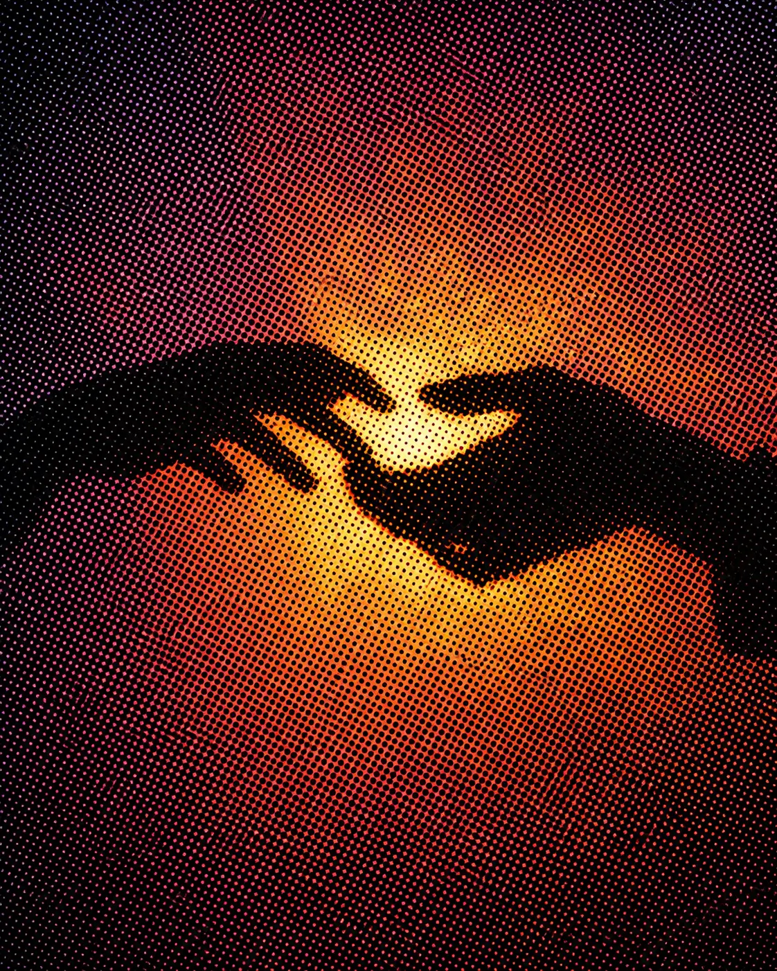 Halftone illustration of two hands reaching toward each other in warm light