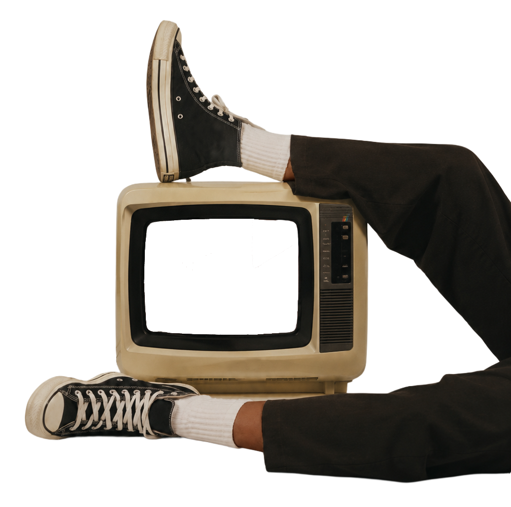 Vintage television with a pair of canvas sneakers resting on top